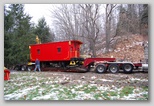 Dragging the caboose, on rails, up the slope.
